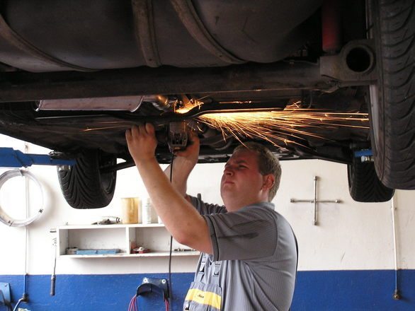 Mechanic working in tire service center